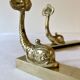 Brass wall supports for bathroom shelf, circa 1950.