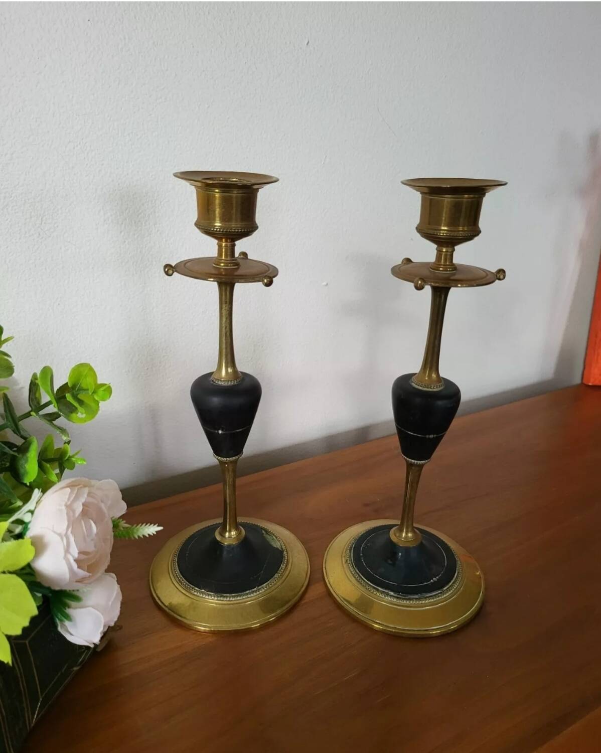Pair of brass and black hard stone candlesticks