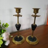 Pair of brass and black hard stone candlesticks