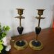 Pair of brass and black hard stone candlesticks