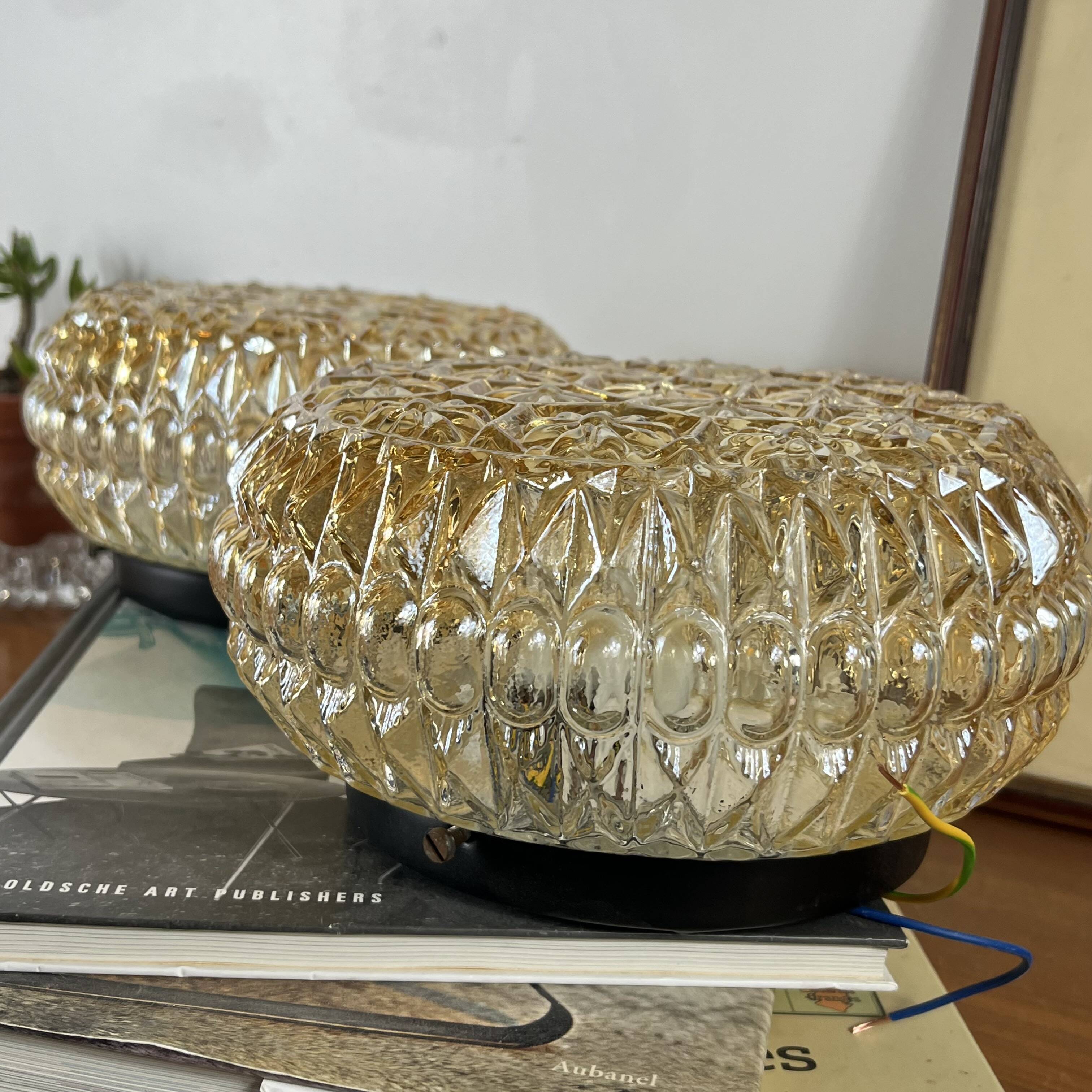 Pair of amber glass ceiling sconces with small vintage flowers.