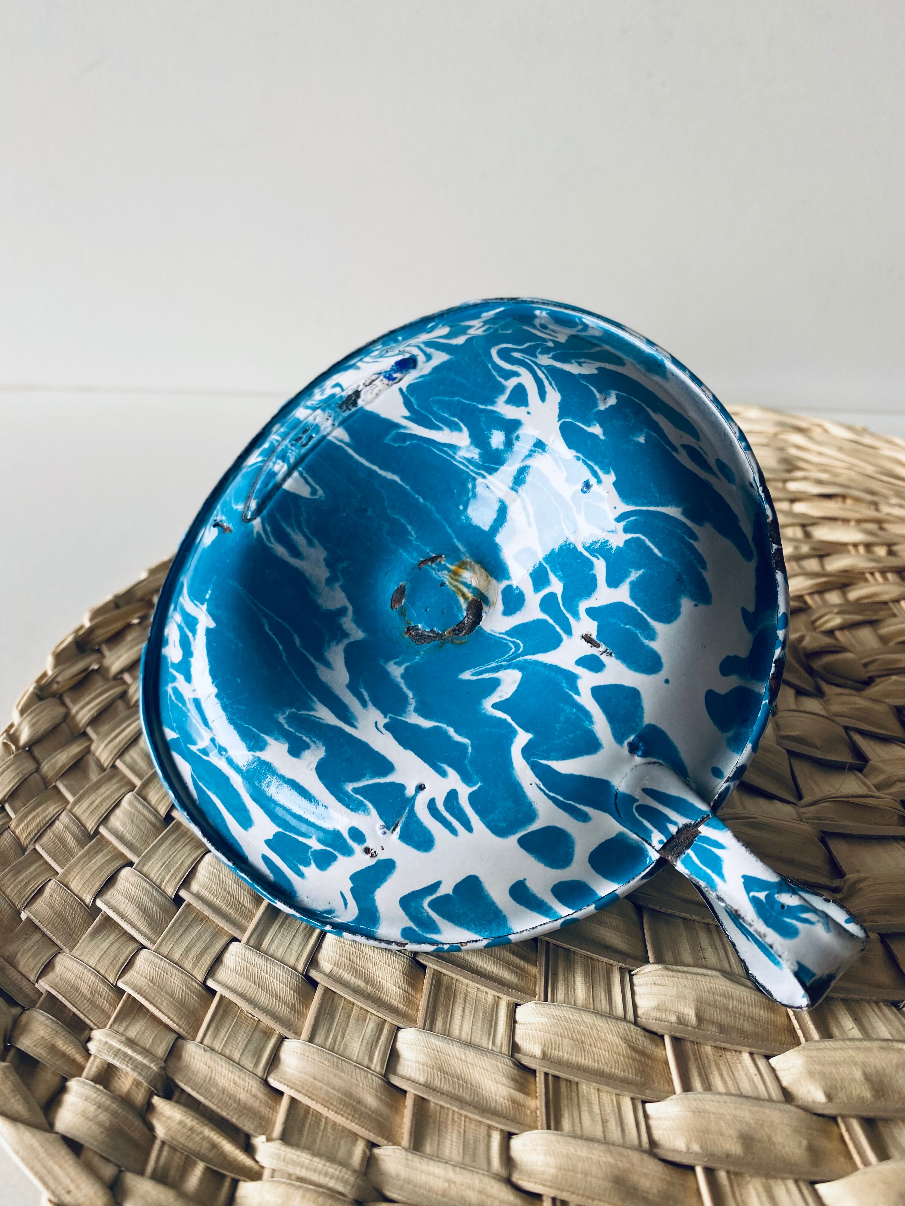 Old enamelled metal candlestick