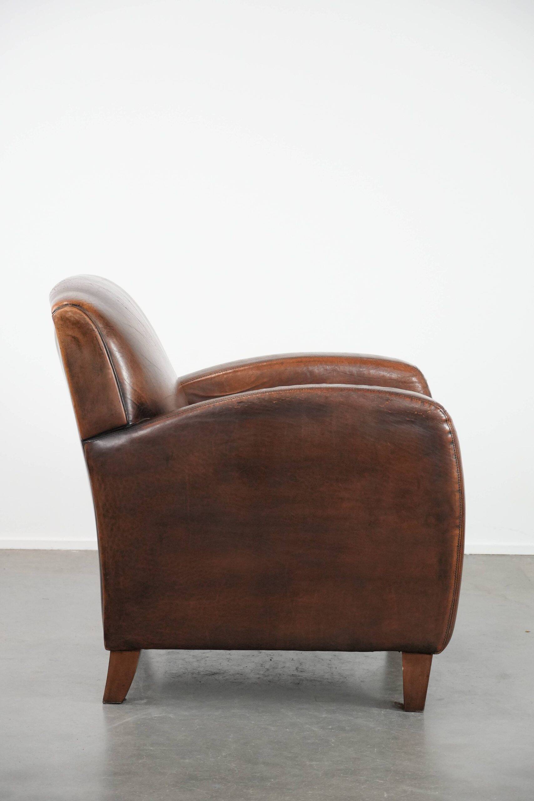Characterful vintage sheepskin leather armchair with beautiful colours