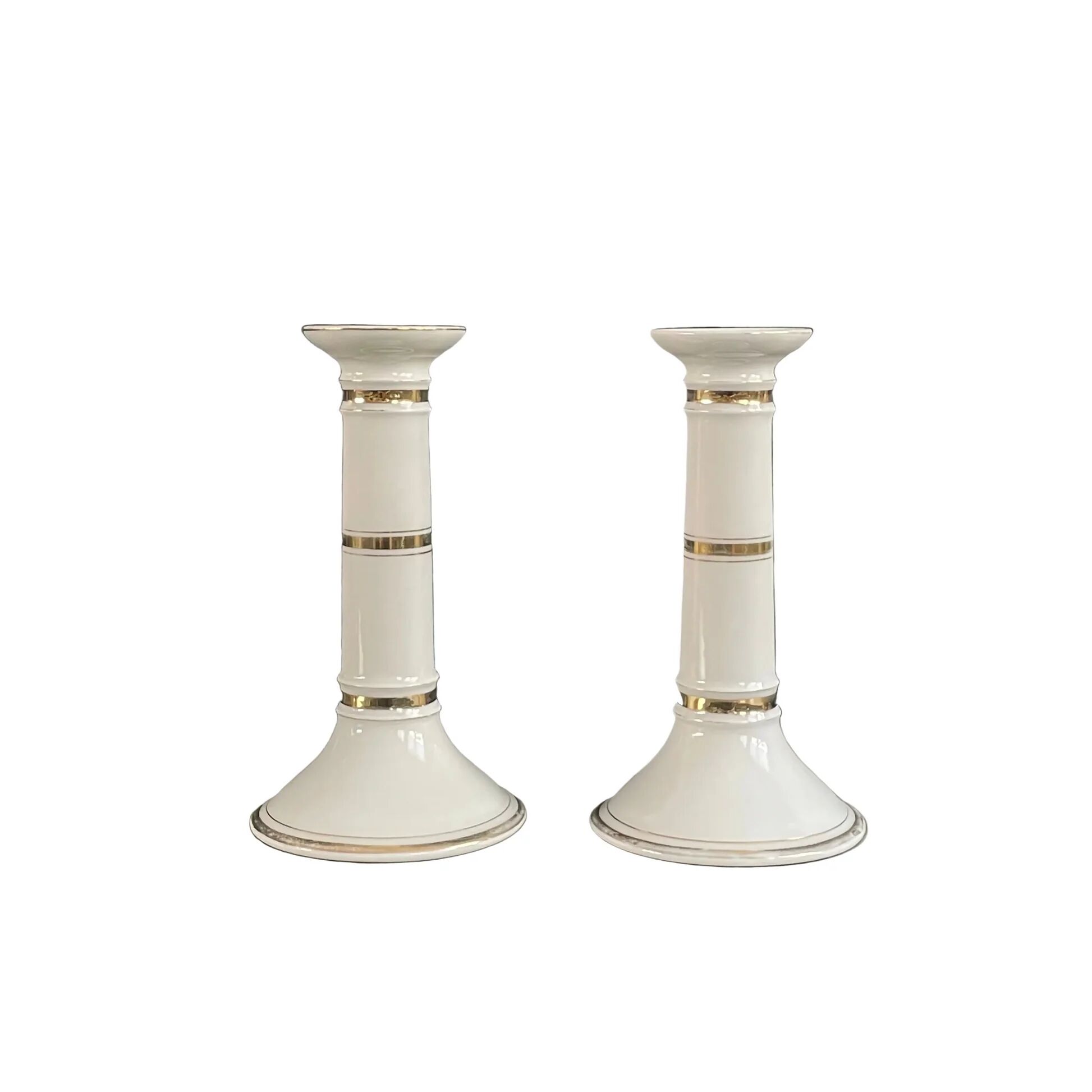 Pair of porcelain candlesticks with a gold pattern.