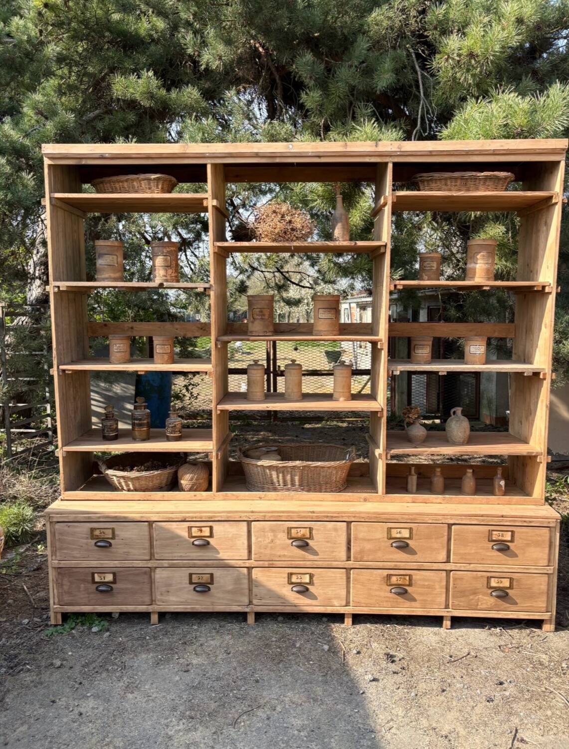 Large antique workshop furniture with drawers and shelves.