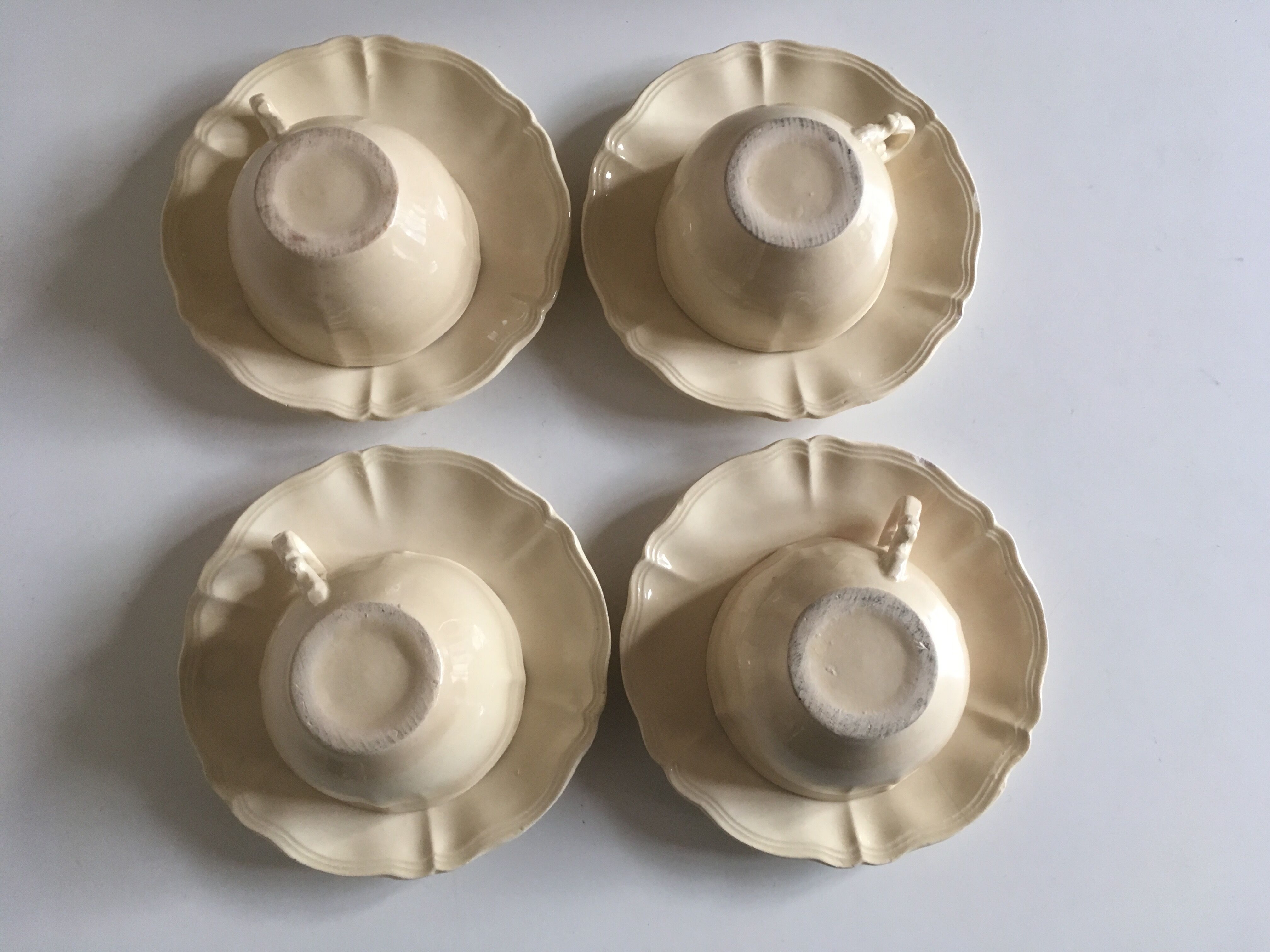 4 cups set in ivory faience from Sarreguemines to godrons