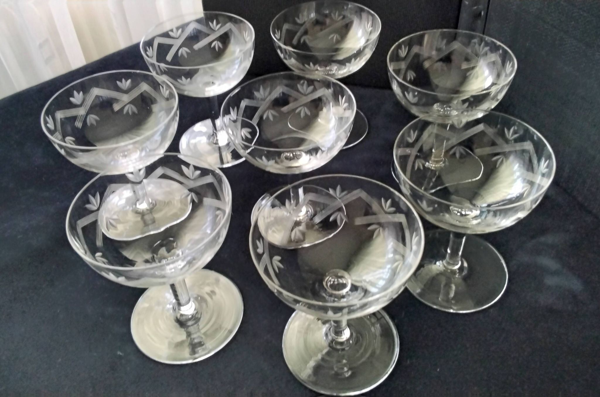 8 vintage champagne coupes with engraved decoration