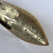 Indian brass ashtray with engraved floral decoration in the shape of a slipper