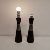 Two table lamps made of dark-stained wood with silver detail in the middle.