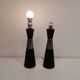 Two table lamps made of dark-stained wood with silver detail in the middle.