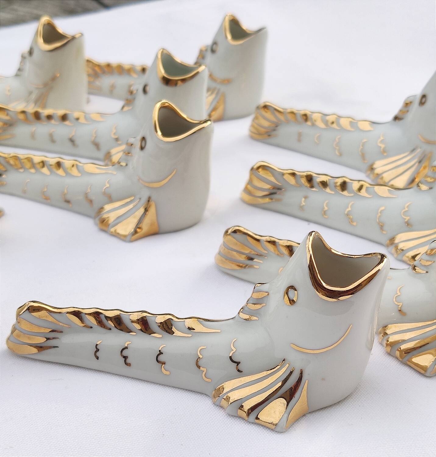 White and gold Limoges porcelain knife rests - animal motif: fish