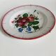Eastern earthenware plate from the mid-19th century with a hollow rose design.