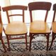 Set of 4 light wood bistro chairs stamped Baumann and Thonet.