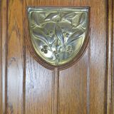 Art Nouveau oak buffet and dinanderie panels, circa 1910