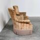 Pair of sculptural Hollywood Regency lounge chairs with original fringed upholstery