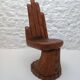 Sculpted wooden chair in the shape of a hand, 1960.