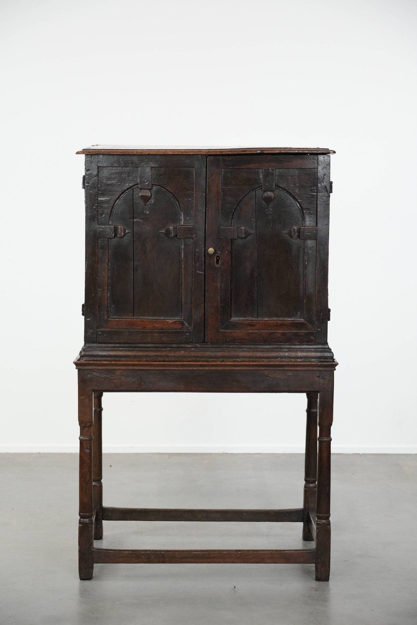 Unique antique English cabinet on stand made of oak from the 17th century