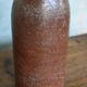 Set of 2 sandstone bottles with ceramic capsule