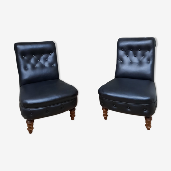 Pair of upholstered low chairs without arms