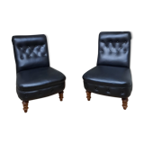 Pair of upholstered low chairs without arms