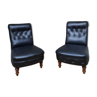 Pair of upholstered low chairs without arms