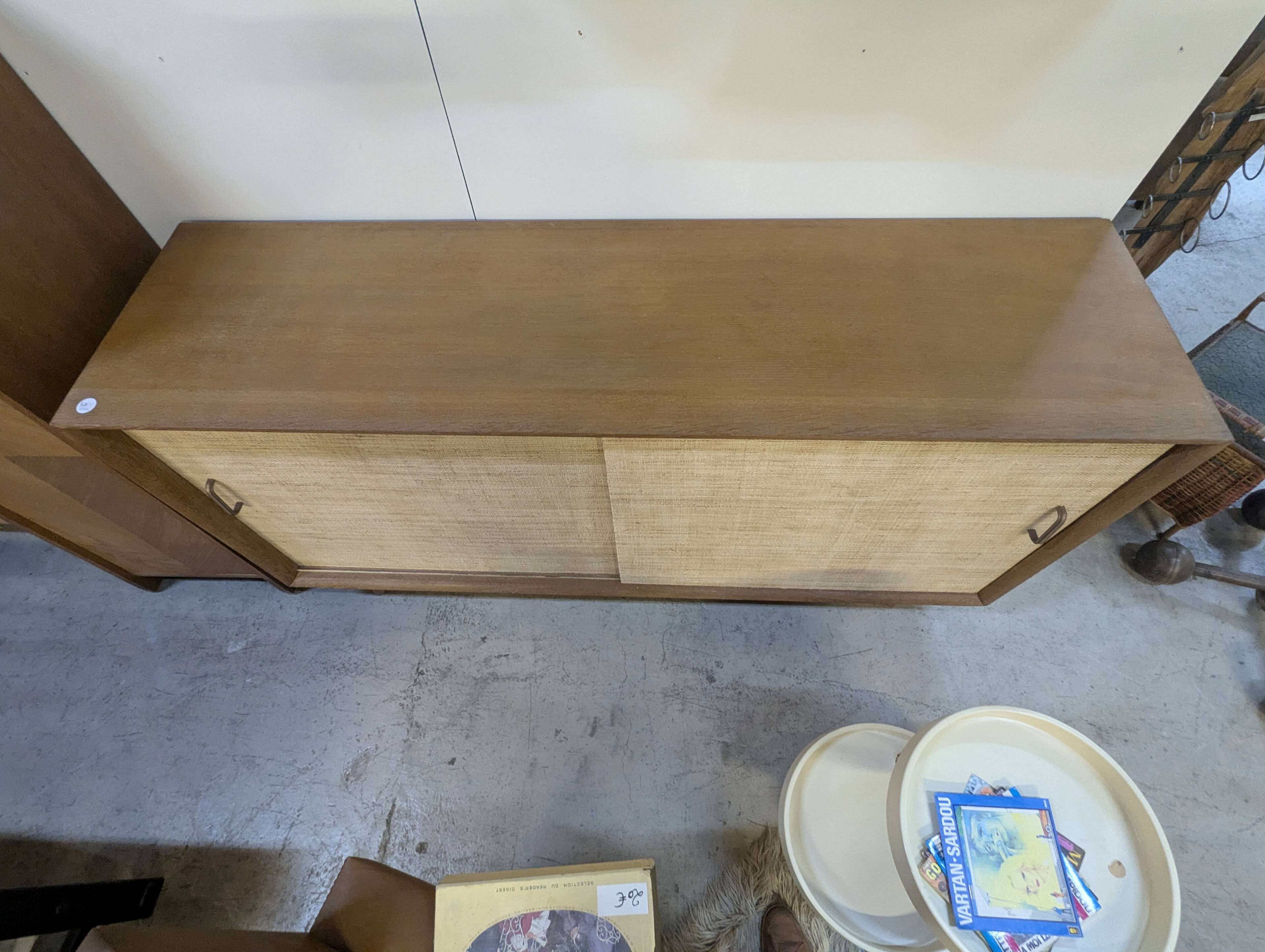 Modernist sideboard in oak with rattan doors.