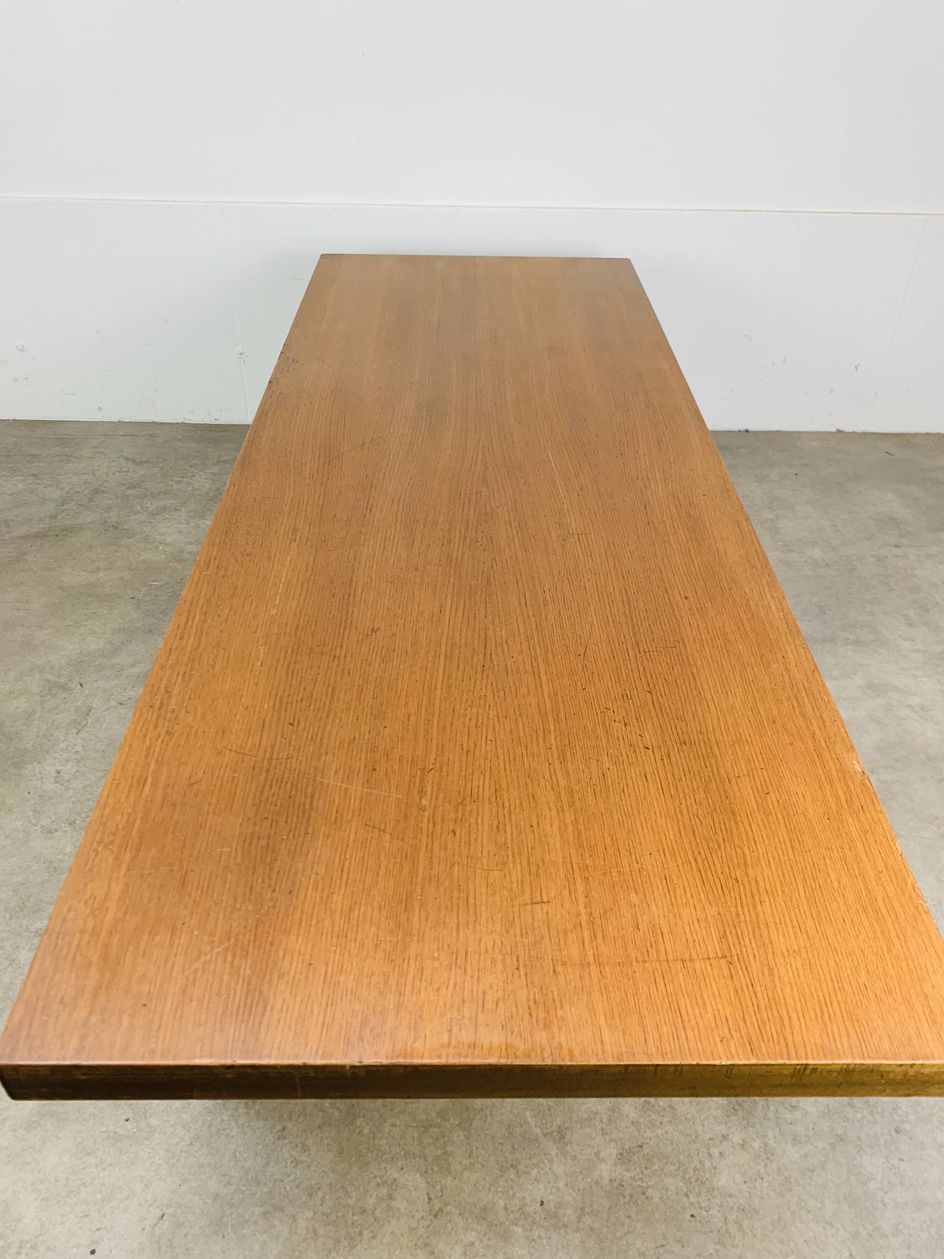 1950s modernist coffee table, wood and black metal.