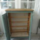Vintage shoe cabinet smoked green wax finish, wooden top.