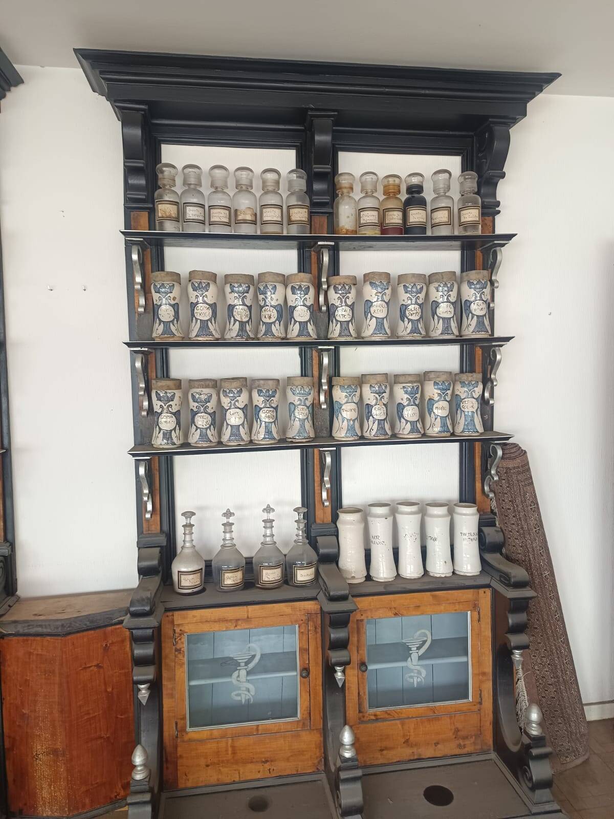 Antique Spanish pharmacy shelves and apothecary table (late 19th c.)
