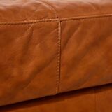 Ottoman with leather upholstery