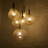“Cascade” brass chandelier with amber globes