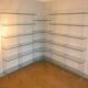 Library/shelves in tempered glass, plexiglass and brass from the collection