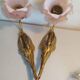 Pair of bronze swan and pink tulip wall lights in glass paste