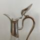 Glass decanters and silver metal spouts
