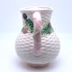 Pale pink slip decanter and colorful fruist