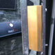 Copper brutalist entrance door, 70s architecture