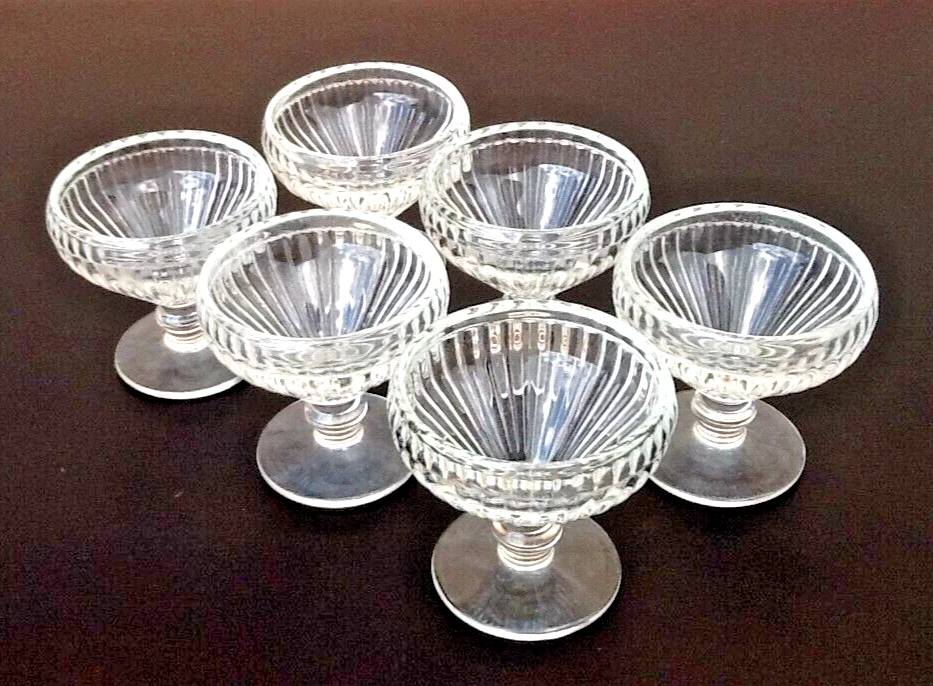 6 footed ice cream bowls, ribbed transparent glass, Made in France.