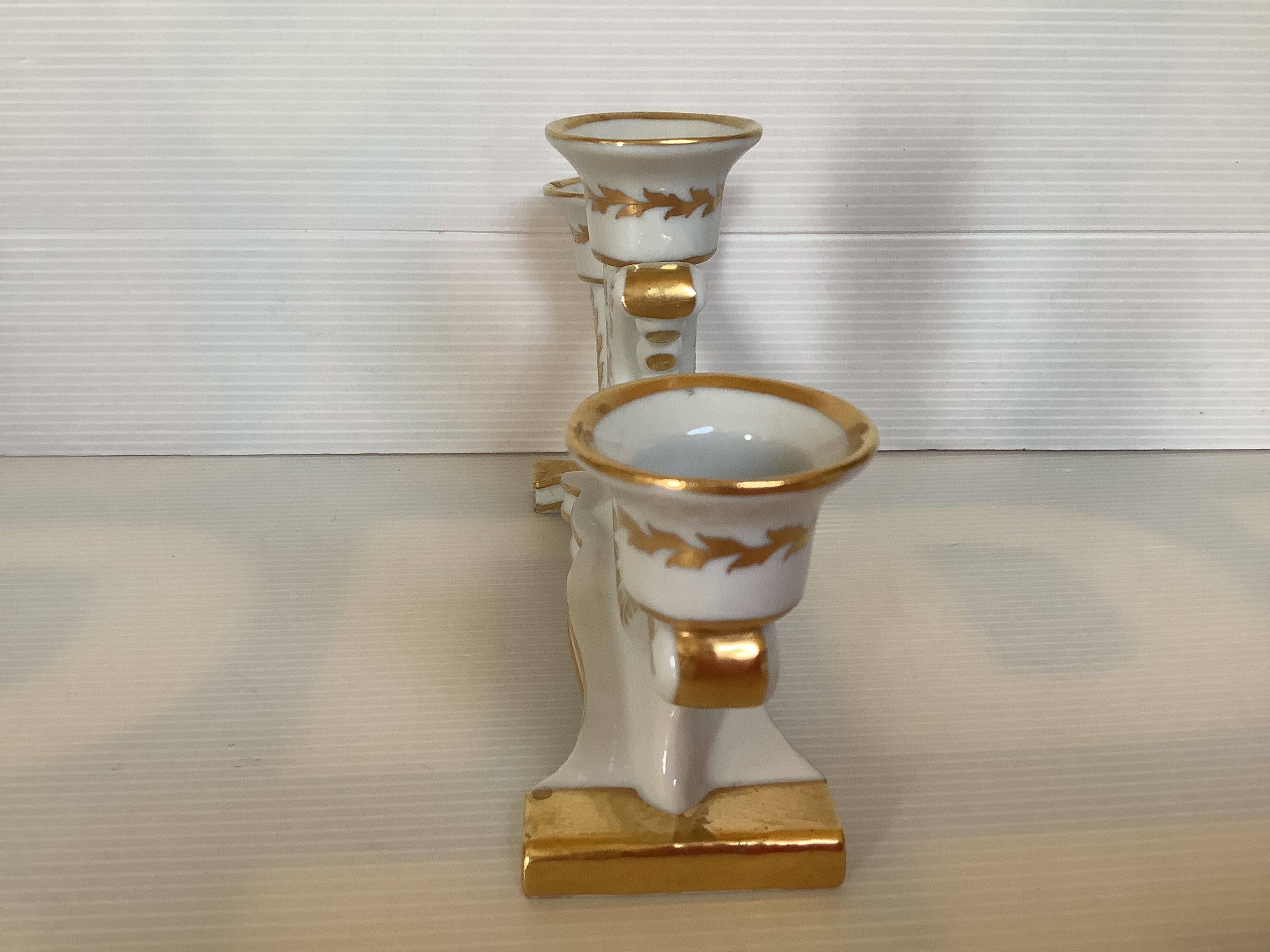 Old white and gold candlestick Belgium