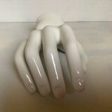 Coat hook representing a hand