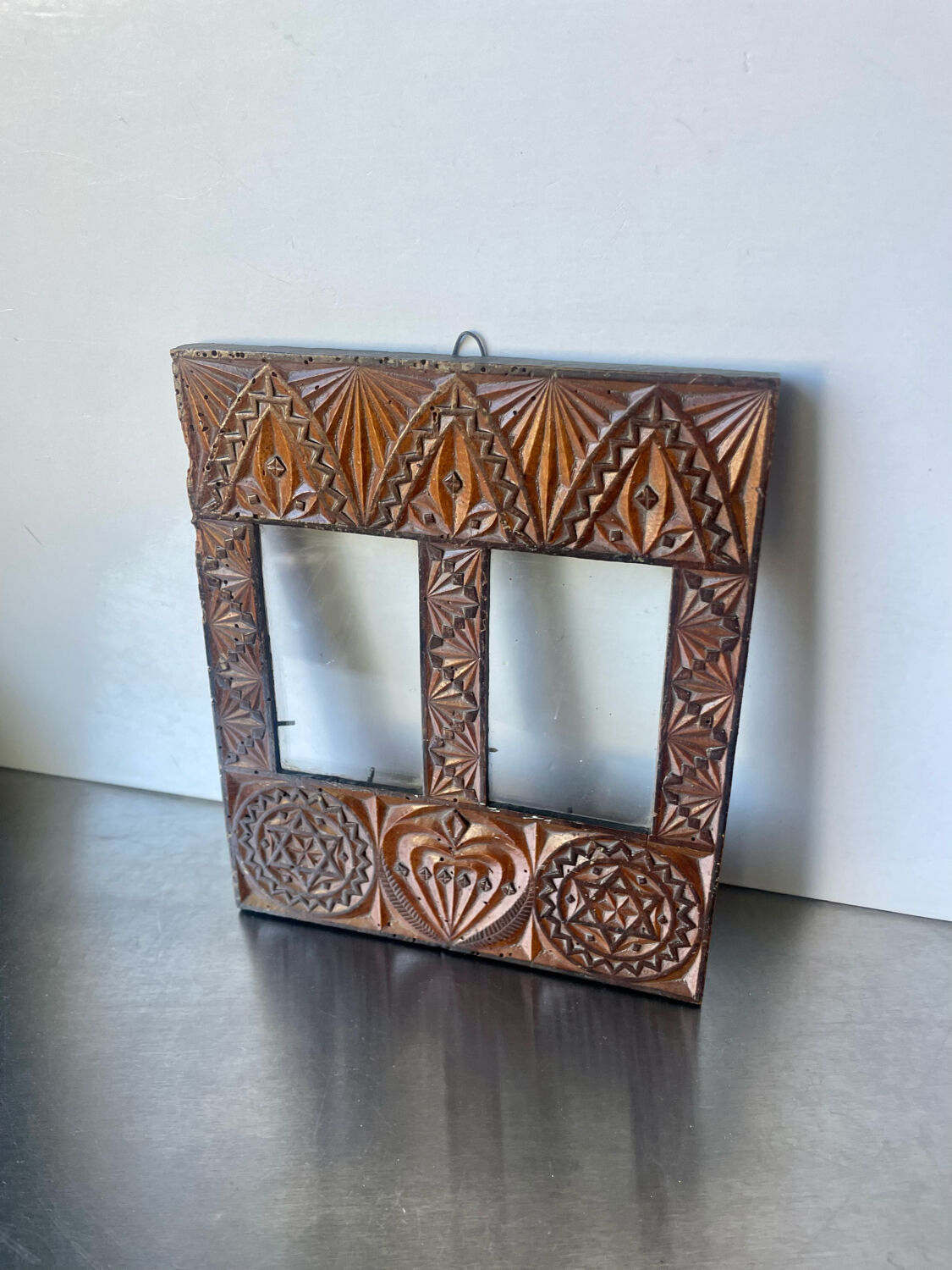 Double frame intricately carved wood