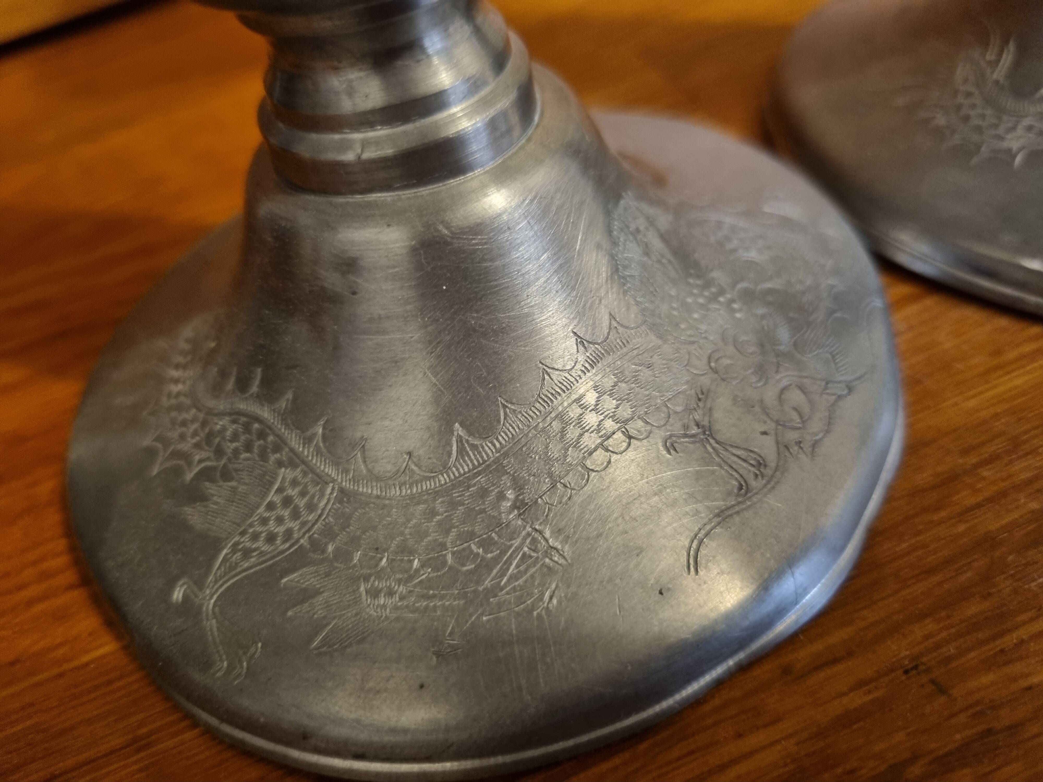 Pair of old Chinese candlesticks in engraved pewter
