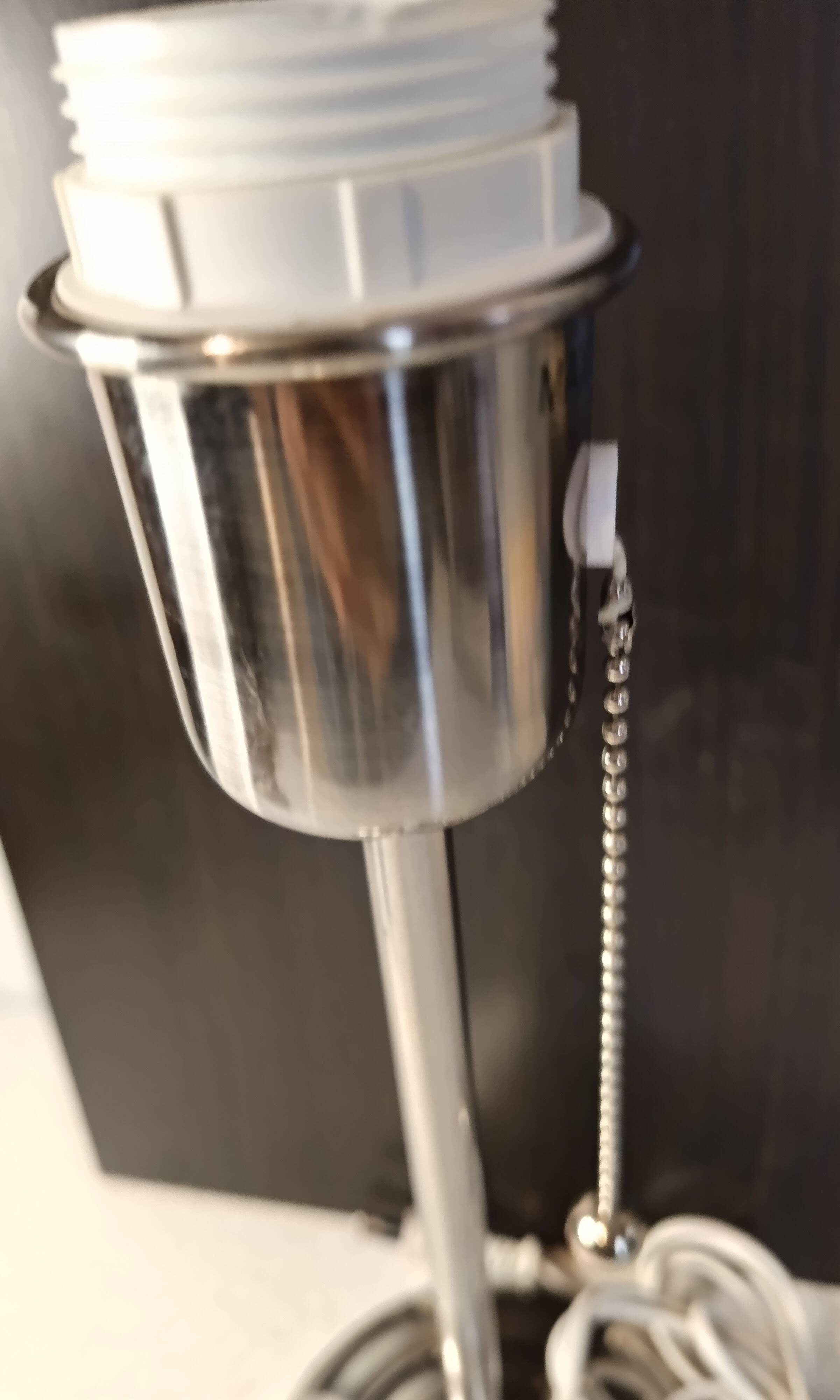Modern white nickel lamp base with pull switch.