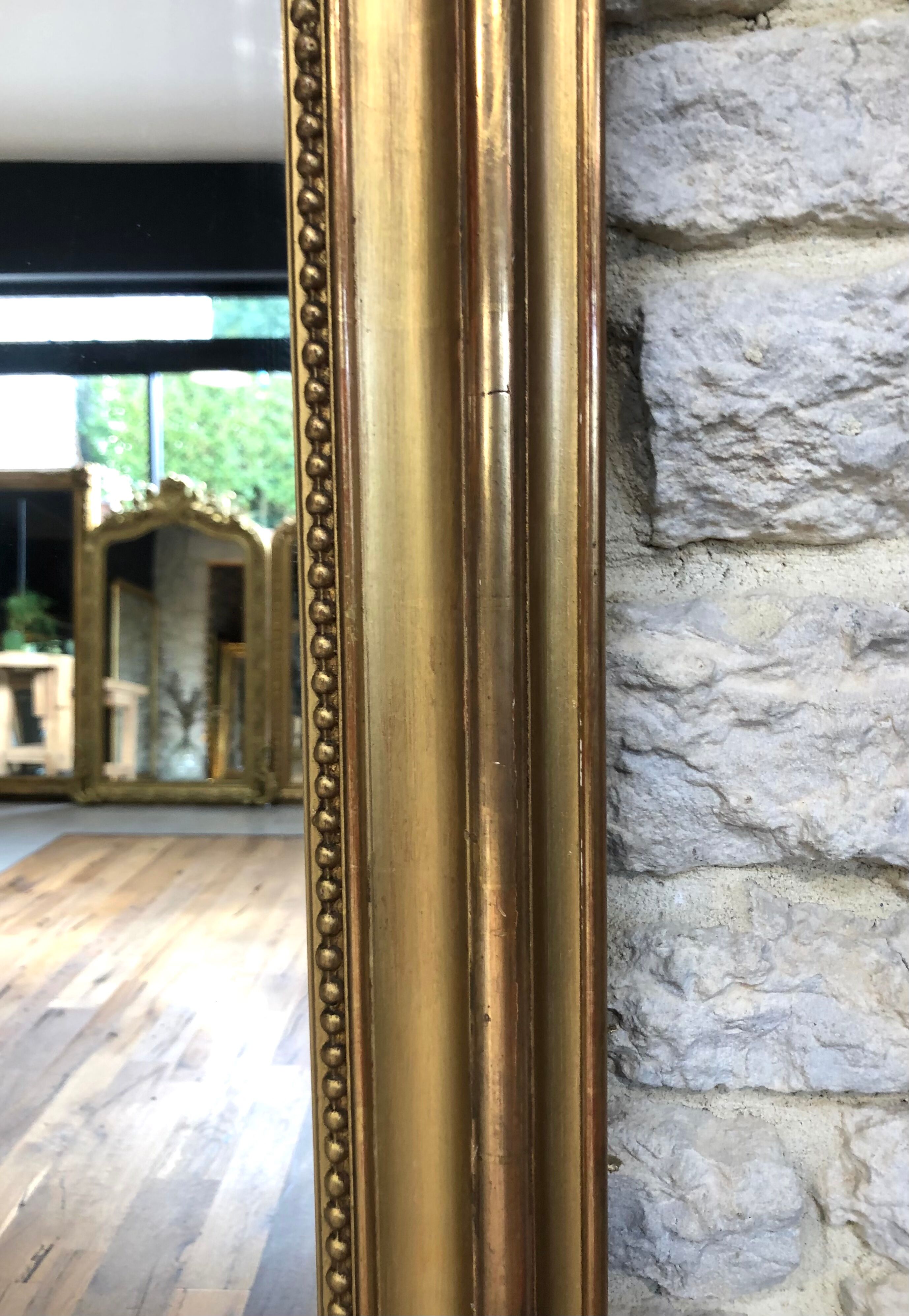 Old fireplace mirror 144cm/97.5cm, pearled, late 19th century, gilded with pricked ice leaf.