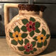 Ceramic pitcher with floral decoration signed Lucq
