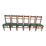 6 modern chairs with banded backs and green faux leather seats