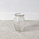 Small transparent molded glass vase