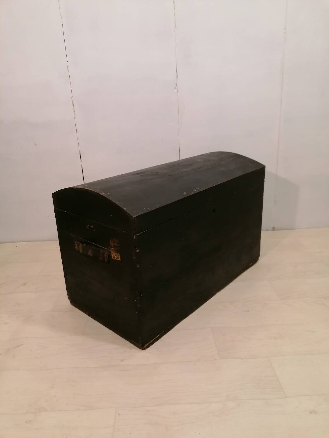 Large travel trunk in blackened wood