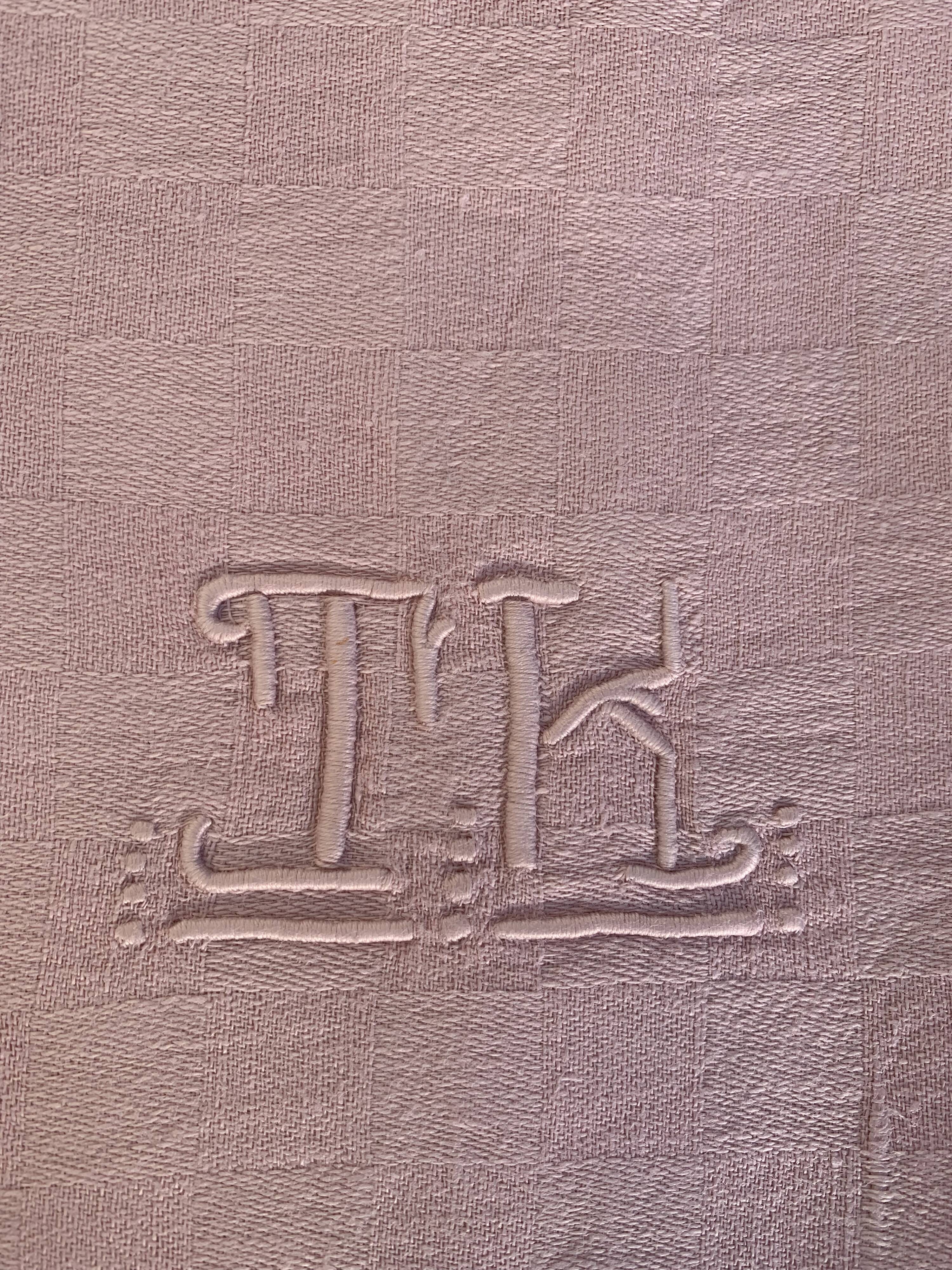 Duo set, consisting of two large pink-dyed cotton and linen towels, embroidered, TK monograms