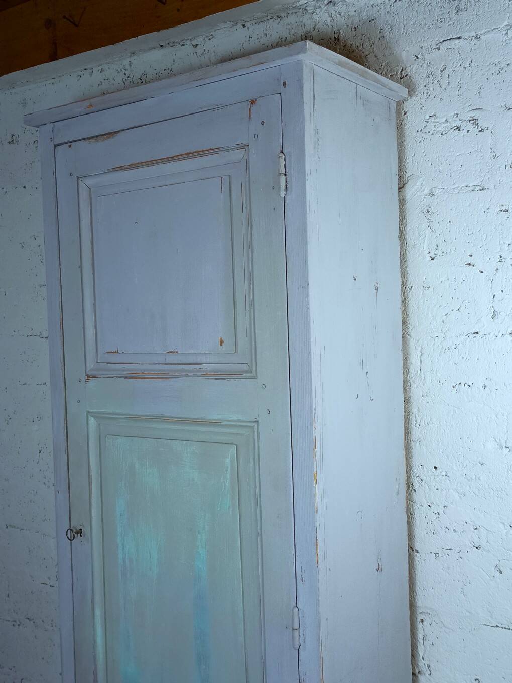 Rustic antique bonnetière in weathered blue-grey wood.