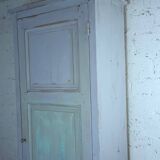 Rustic antique bonnetière in weathered blue-grey wood.